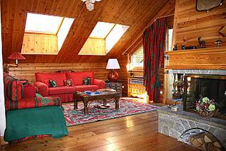 Living room & fire of self catered apartment in Meribel Centre