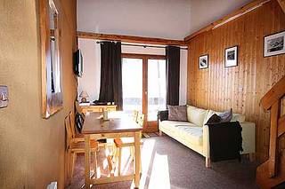 Living area of AMSRentals piste-side apartment in Mottaret